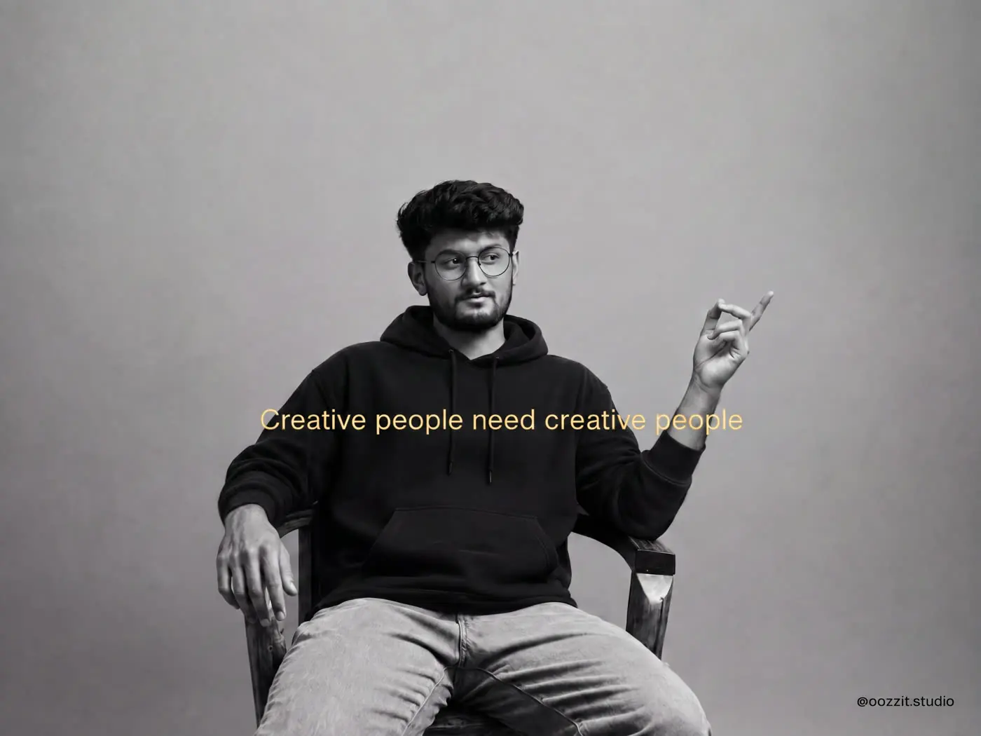 Aditya Narayan, seated, in a black hoodie, with the line Creative people need creative people.